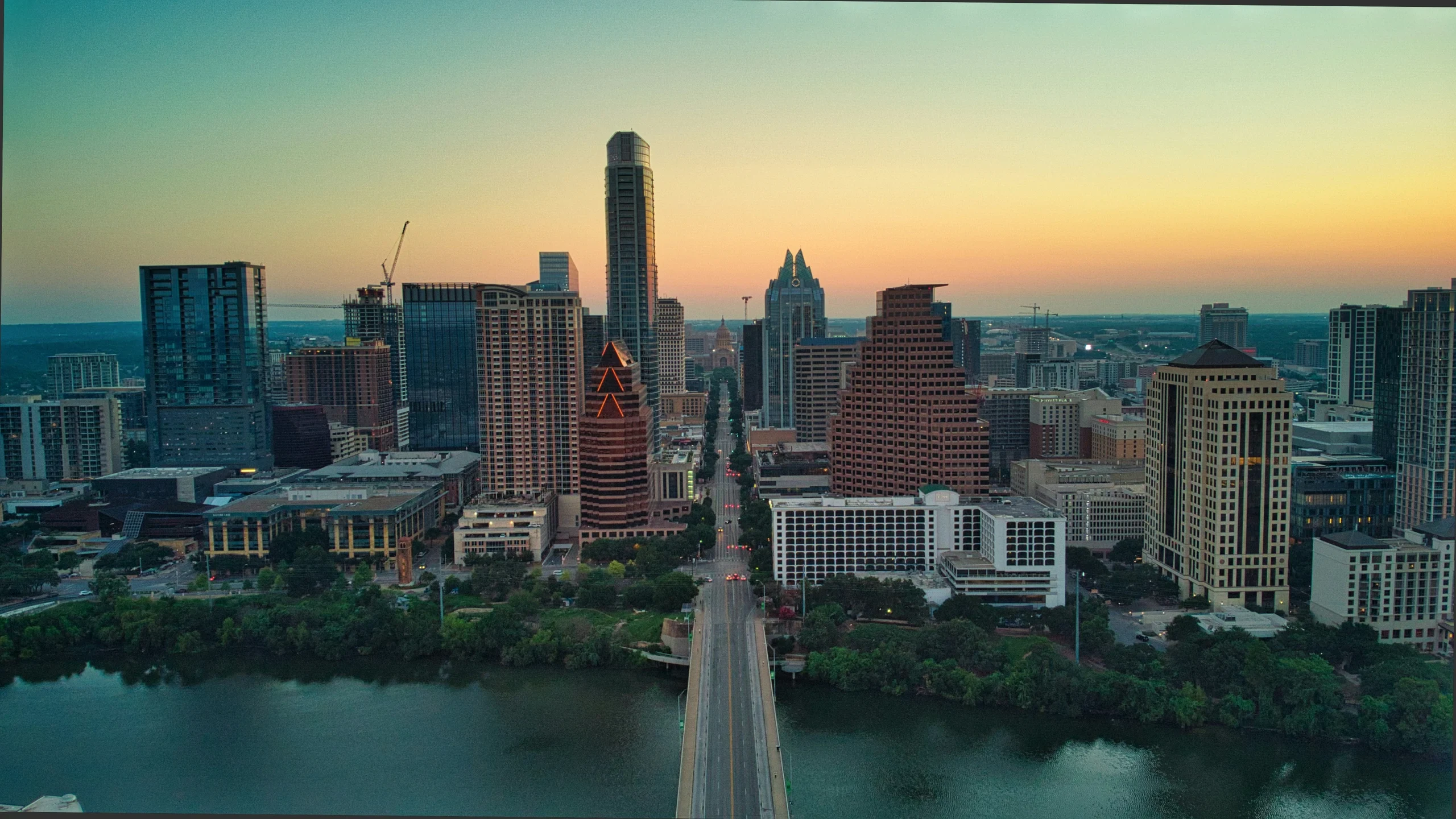Aerial view of downtown Austin, Texas, and the Colorado River at sunrise